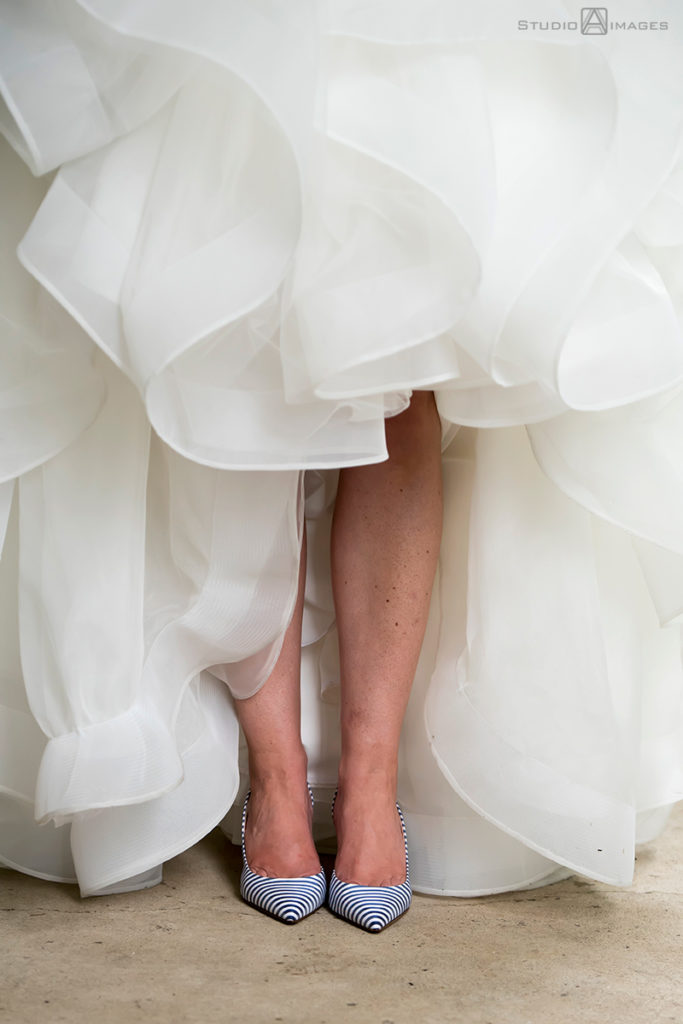bride and her wedding shoes at the Madison Hotel in Morristown on her wedding day