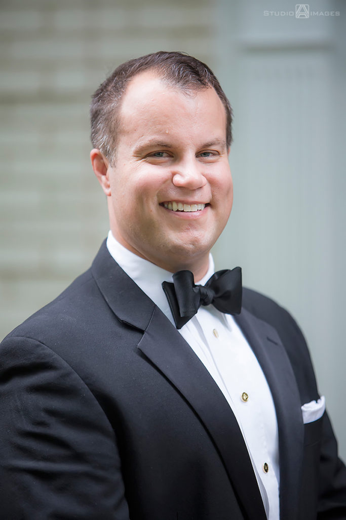 Groom smiling on their wedding day at The Madison Hotel in Morristown. 