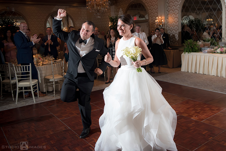 bride and groom enter wedding reception at The Madison Hotel in Morristown wedding