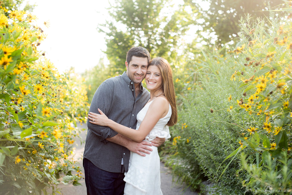couple posing for their engagement photos at Governors Island