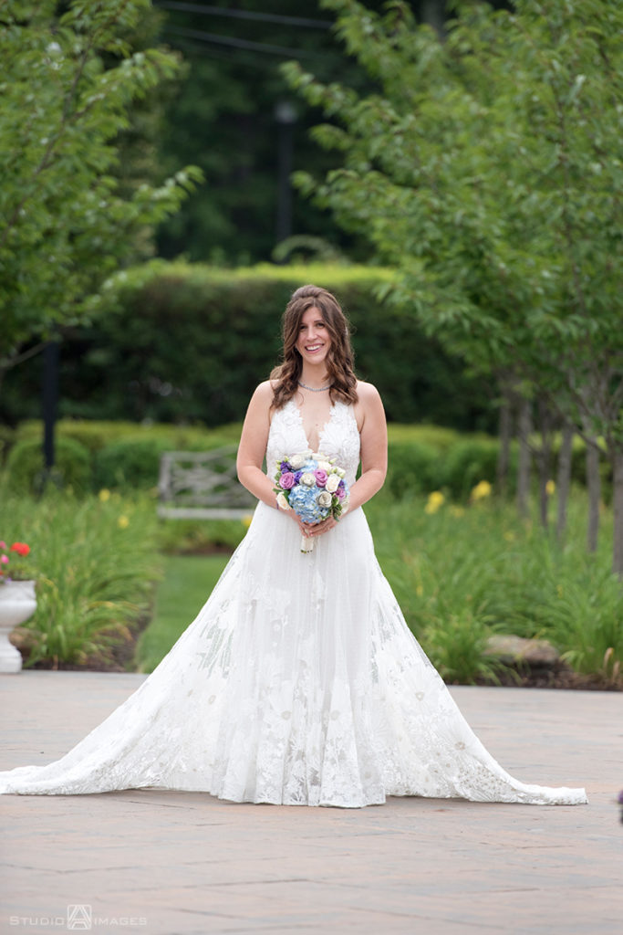 bride on her wedding day at The Rockleigh | Book Inspired Wedding Photos | Book Themed Wedding Photos | LGBTQ wedding