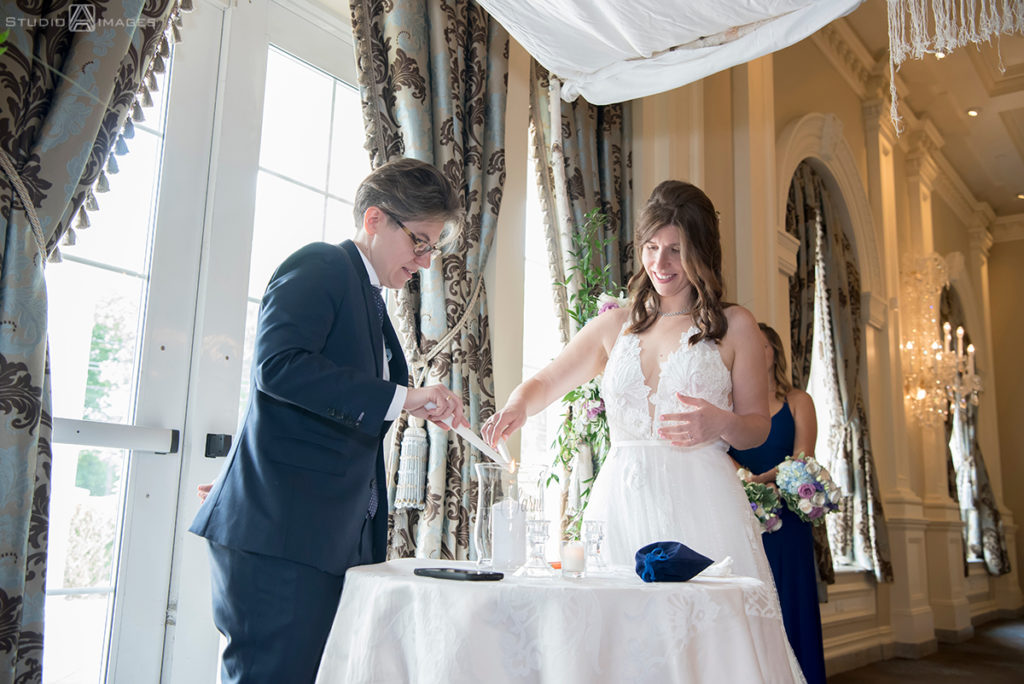 brides at ceremony on wedding day at The Rockleigh | Book Inspired Wedding Photos | Book Themed Wedding Photos | LGBTQ wedding