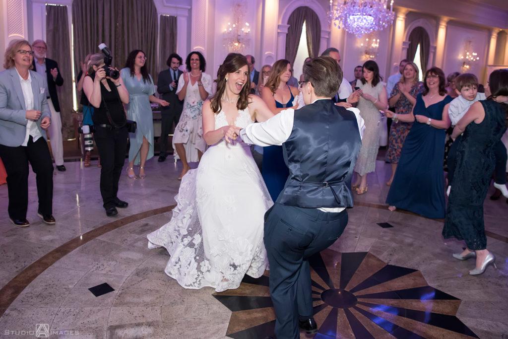 brides dancing on their wedding day at The Rockleigh | Book Inspired Wedding Photos | Book Themed Wedding Photos | LGBTQ wedding