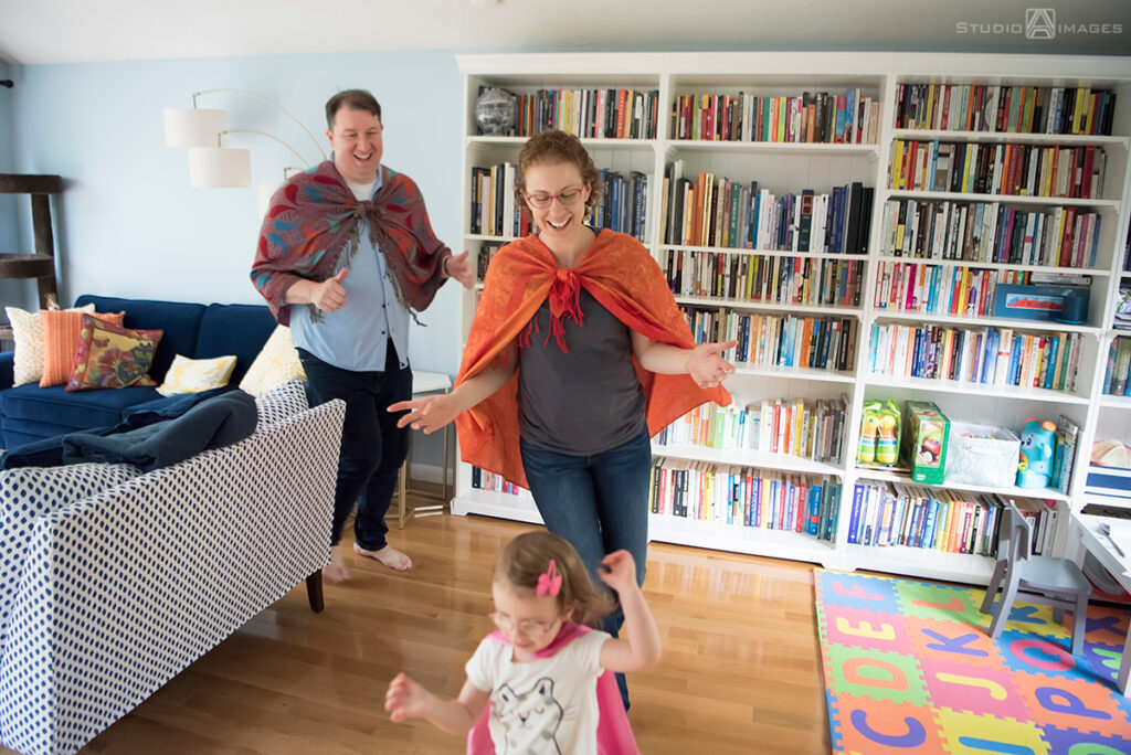 parents playing with their daughter during their Documentary-style day in the life family photo shoot
