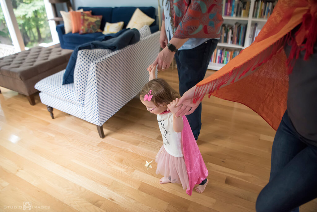 parents playing with their daughter during their Documentary-style day in the life family photo shoot