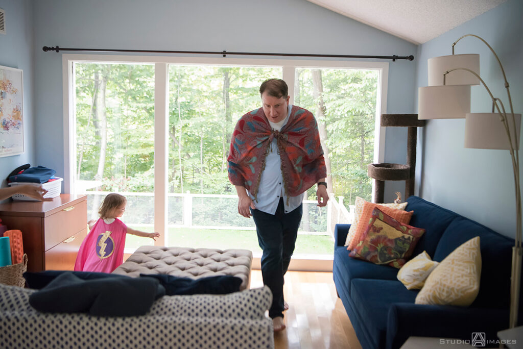 parents playing with their daughter during their Documentary-style day in the life family photo shoot
