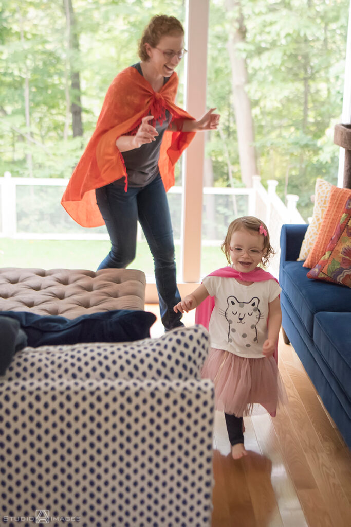 parents playing with their daughter during their Documentary-style day in the life family photo shoot