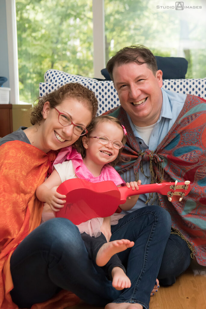 parents playing with their daughter during their Documentary-style day in the life family photo shoot