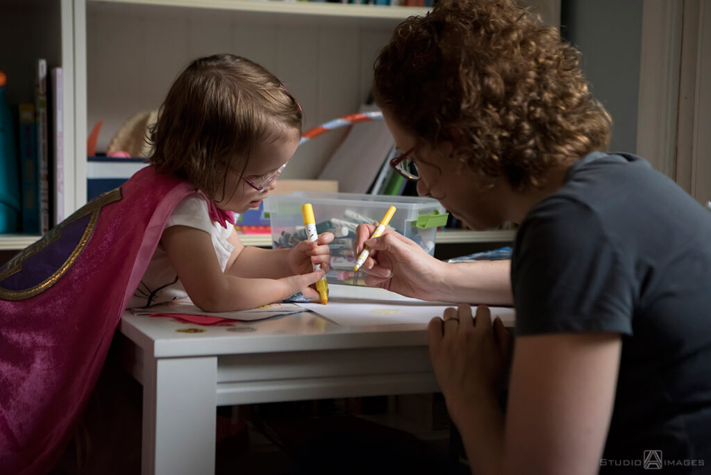 parents playing with their daughter during their Documentary-style day in the life family photo shoot