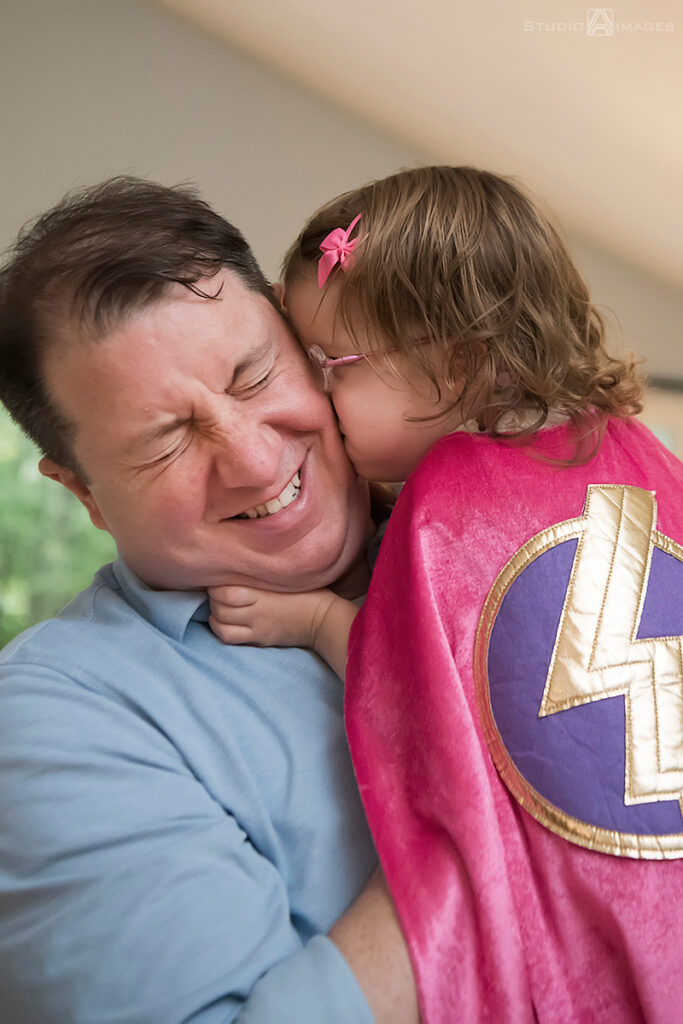 parents playing with their daughter during their Documentary-style day in the life family photo shoot