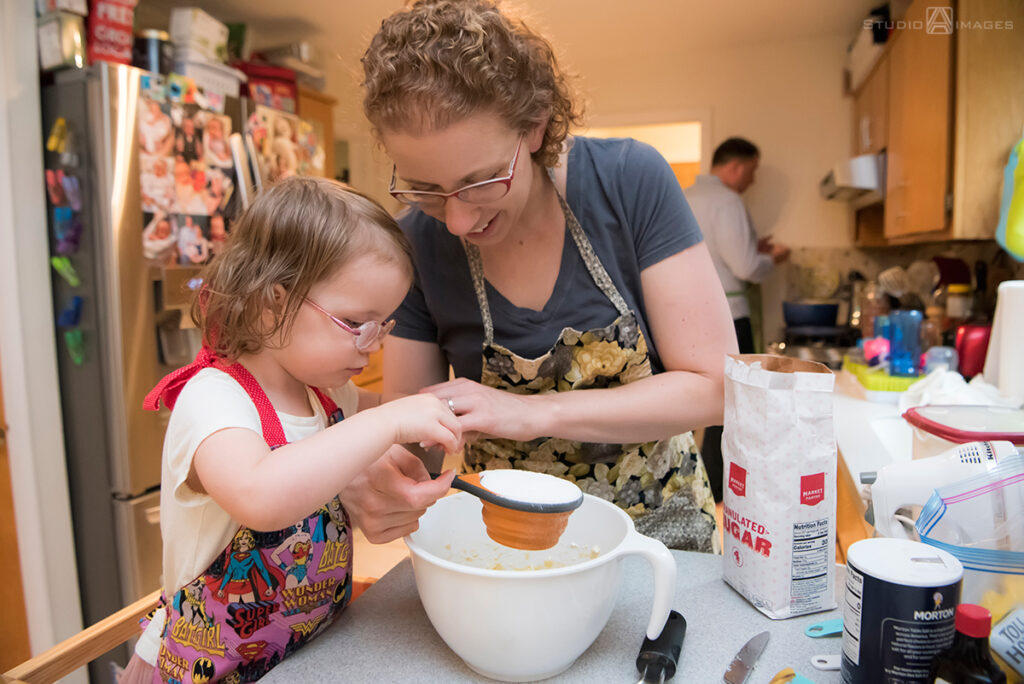 mom and daughter baking  during their Documentary-style day in the life family photo shoot