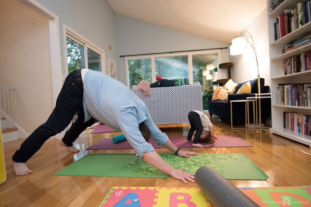 parents playing with their daughter during their Documentary-style day in the life family photo shoot