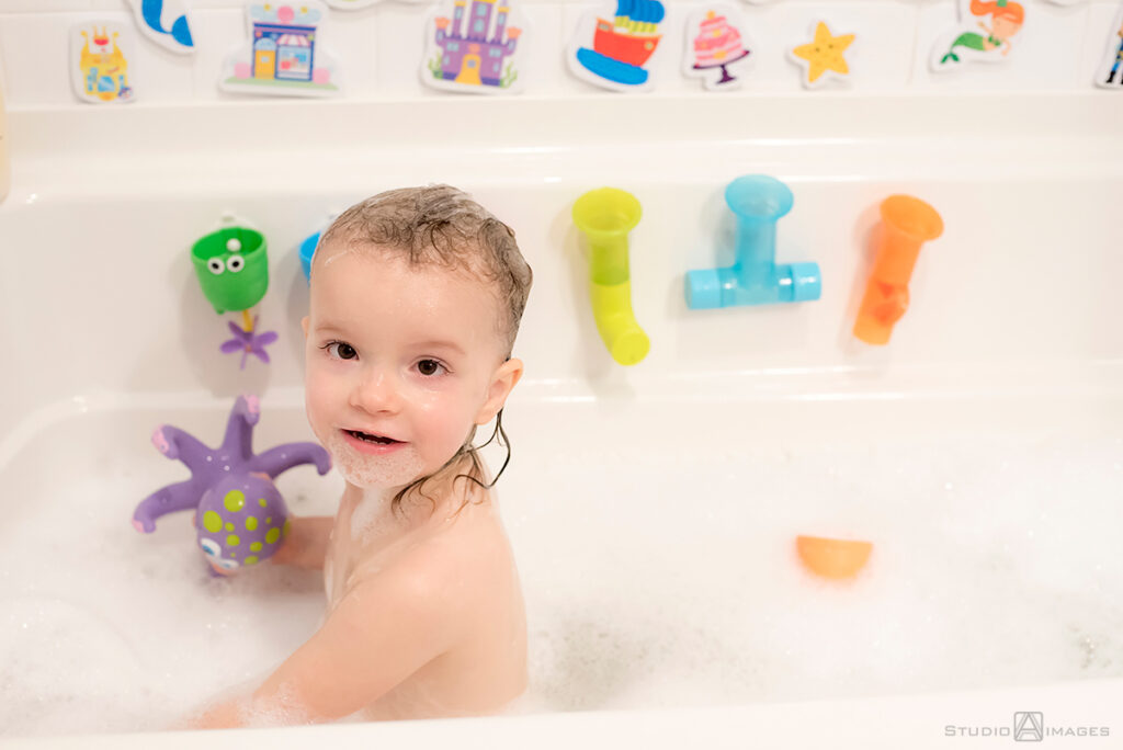 parents and daughter at bath time during their Documentary-style day in the life family photo shoot