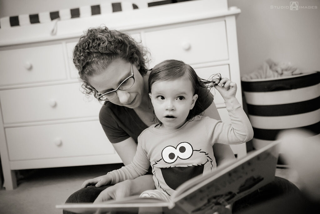 parents and daughter at  bedtime during their Documentary-style day in the life family photo shoot