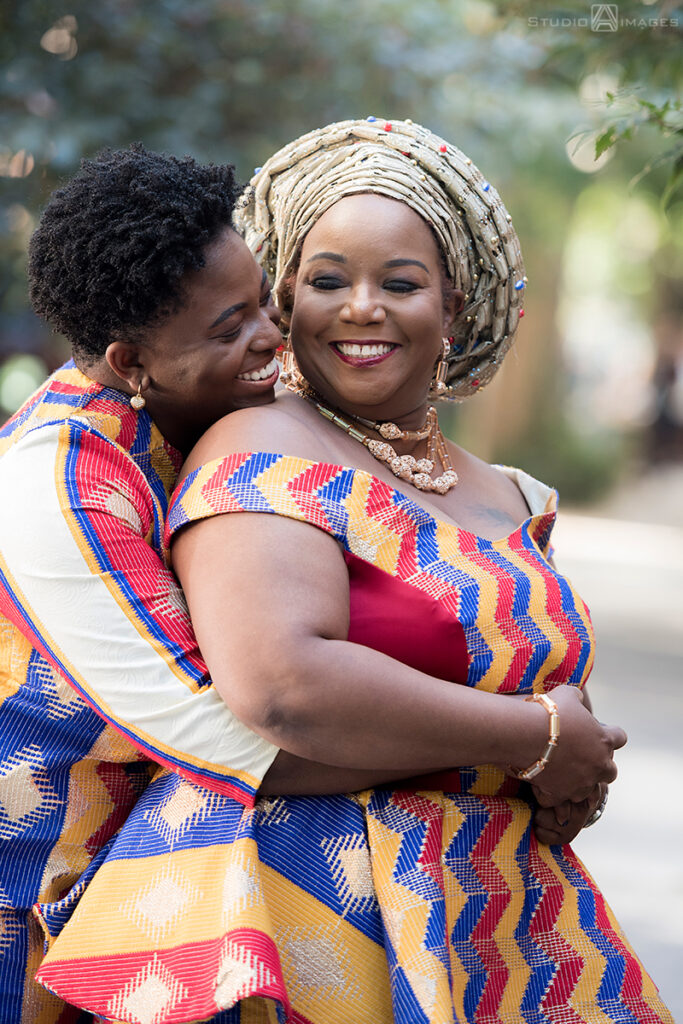 brides in Nigerian-inspired outfits on their wedding day in Brooklyn.  LGBTQ wedding 