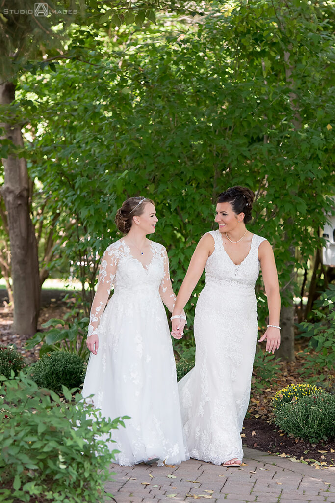 brides posing for portraits on their wedding day at Grain House in Basking Ridge. LGBTQ wedding 
