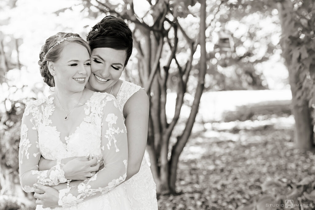 brides posing for portraits on their wedding day at Grain House in Basking Ridge. LGBTQ wedding 