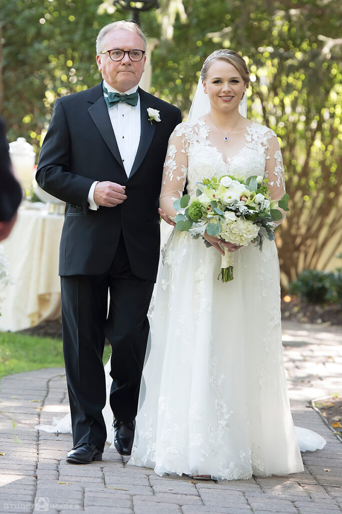 bride and her dad walking down the aisle at wedding ceremony at Grain House in Basking Ridge. LGBTQ wedding 