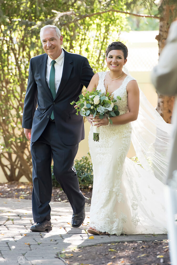 bride and her dad walking down the aisle at wedding ceremony at Grain House in Basking Ridge. LGBTQ wedding 