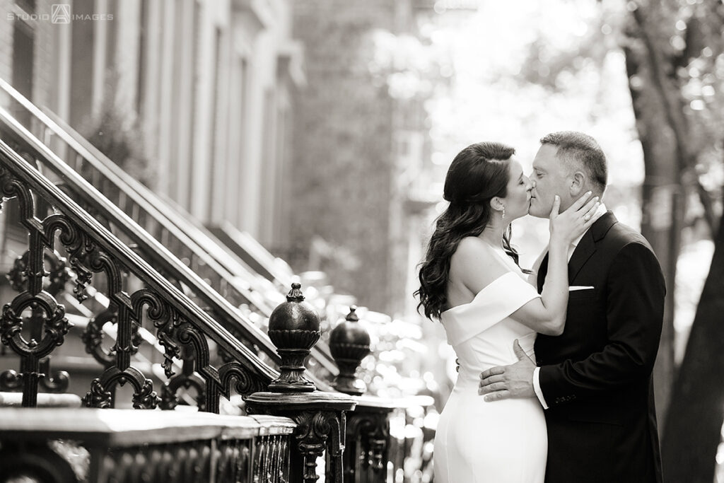 Bride and groom kissing in West Village before their wedding at Little Owl Townhouse