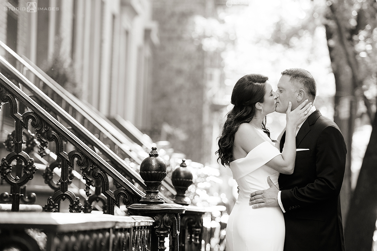 Bride and groom kissing in West Village before their wedding at Little Owl Townhouse