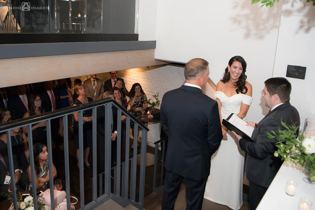 bride and groom during their wedding ceremony at Little Owl Townhouse, NYC
