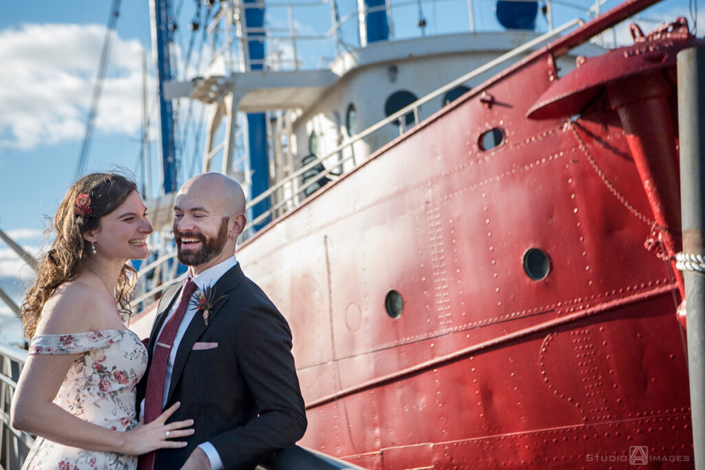 bride and groom posing for portraits before their wedding at Liberty House in Jersey City