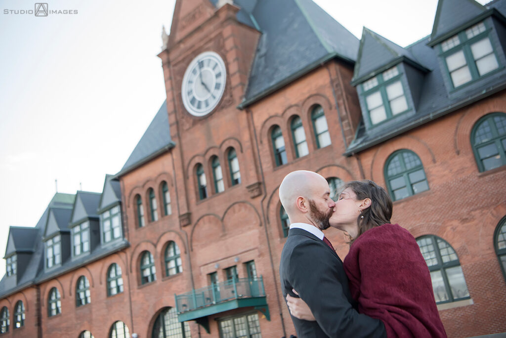 bride and groom posing for portraits in Liberty State Park before their wedding at Liberty House in Jersey City