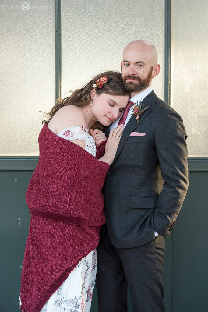 bride and groom posing for portraits in Liberty State Park before their wedding at Liberty House in Jersey City