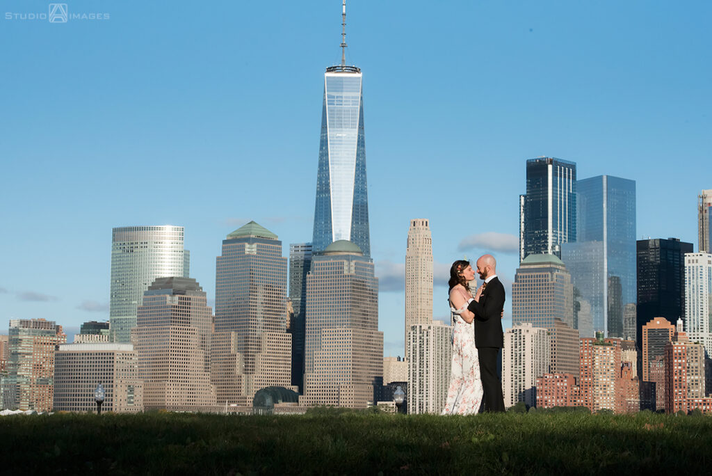 bride and groom posing for portraits in Liberty State Park before their wedding at Liberty House in Jersey City