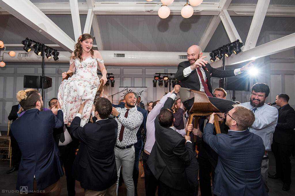 bride and groom during the hora at their wedding reception at Liberty House in Jersey City