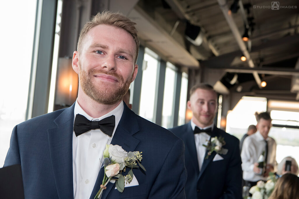 groom during wedding ceremony at Molo's Restaurant in Weehawken
