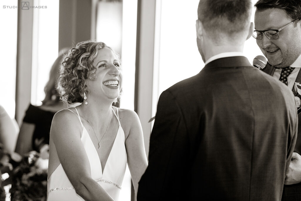 bride and groom during wedding ceremony at Molo's Restaurant in Weehawken