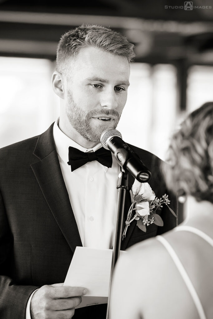 bride and groom during wedding ceremony at Molo's Restaurant in Weehawken