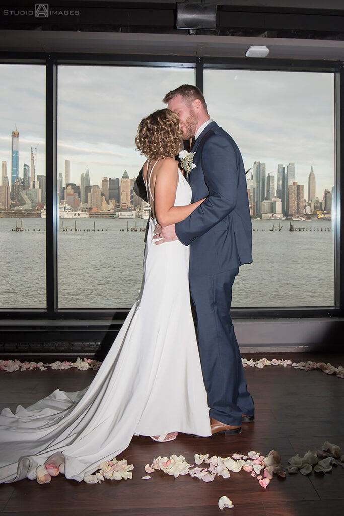 bride and groom during wedding ceremony at Molo's Restaurant in Weehawken