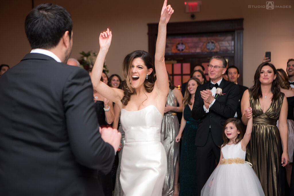 bride and groom enter wedding reception at Temple Emanu-El of Closter
