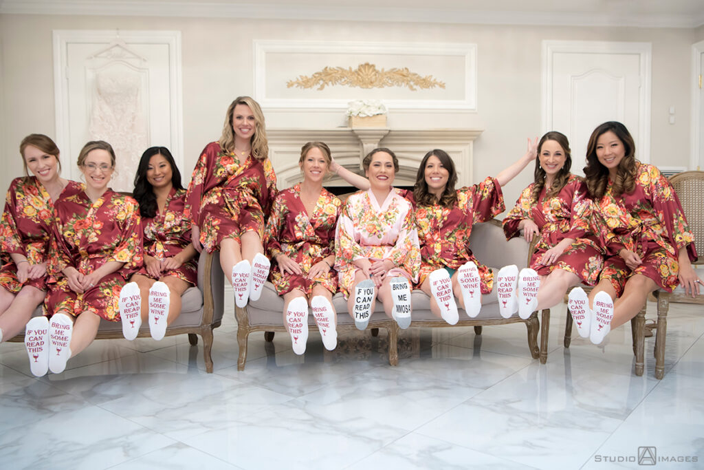 bride and bridesmaids with wine socks before wedding at Florentine Gardens