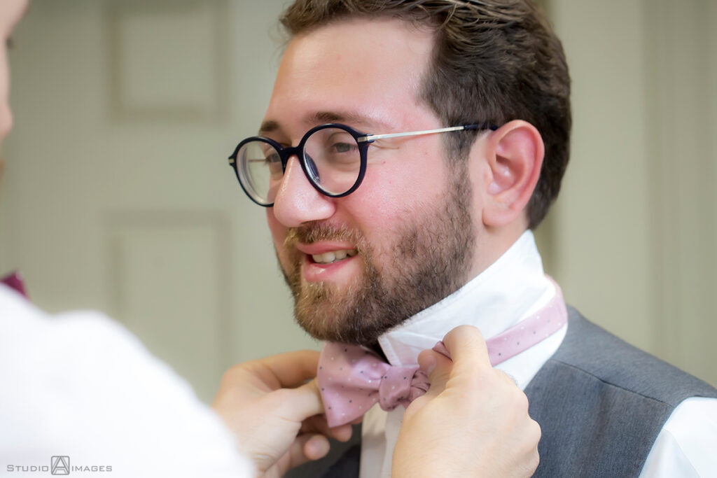 groom getting ready before wedding at Florentine Gardens