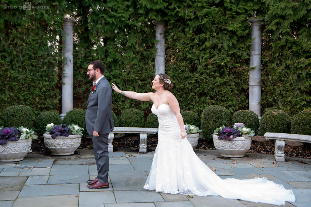 bride and groom's first look at Florentine Gardens on their wedding day