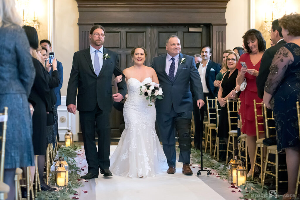 bride walking down the aisle at Florentine Gardens on their wedding day