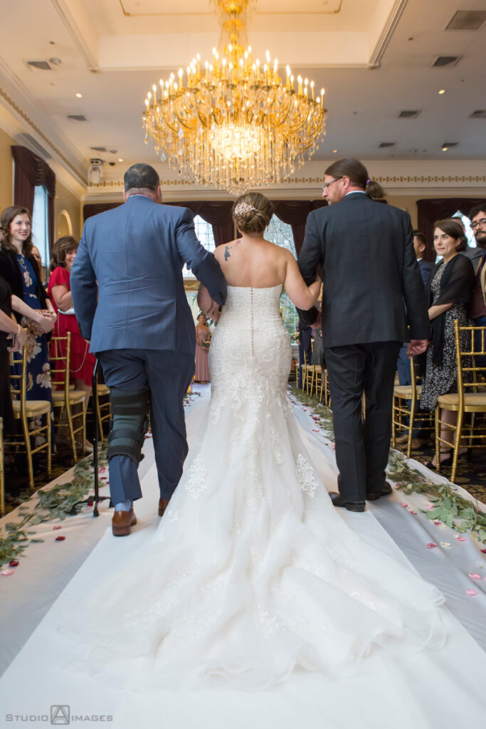 bride walking down the aisle at Florentine Gardens on their wedding day