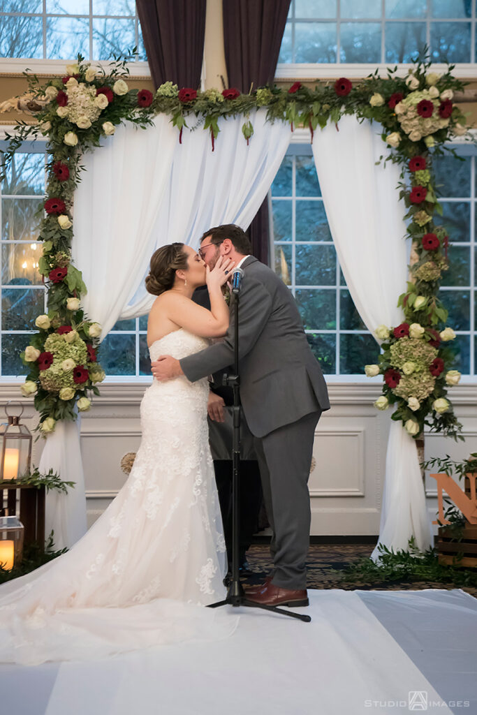 bride and groom during their wedding ceremony at Florentine Gardens 