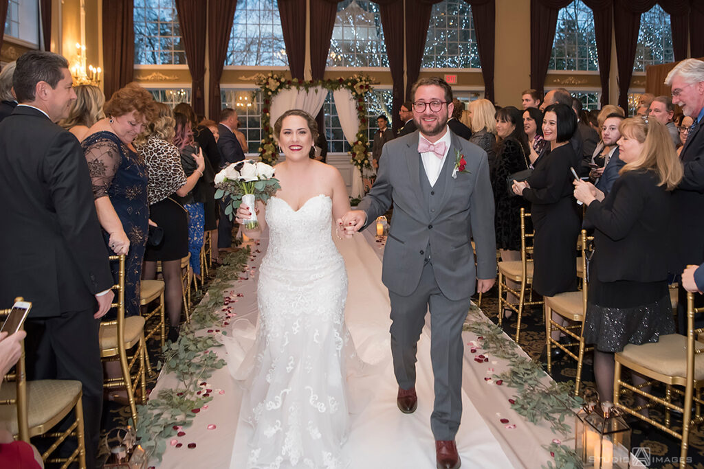 bride and groom during their wedding ceremony at Florentine Gardens 