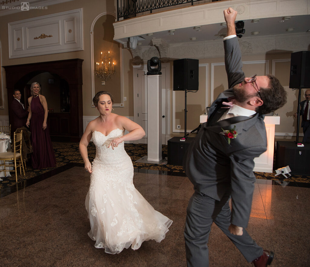 bride and groom enter their wedding reception at Florentine Gardens wedding