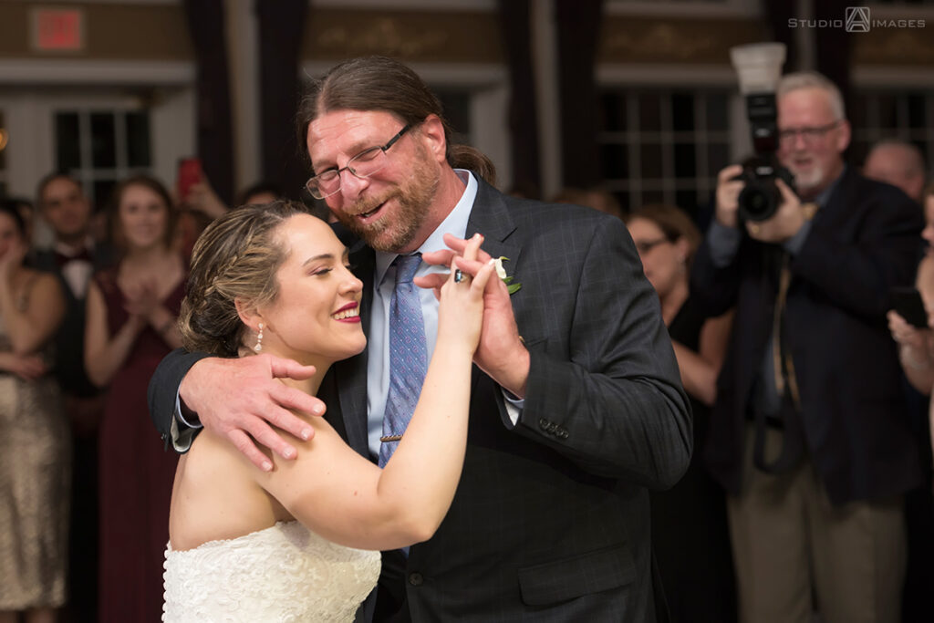 bride and stepfather dance at their wedding reception at Florentine Gardens wedding