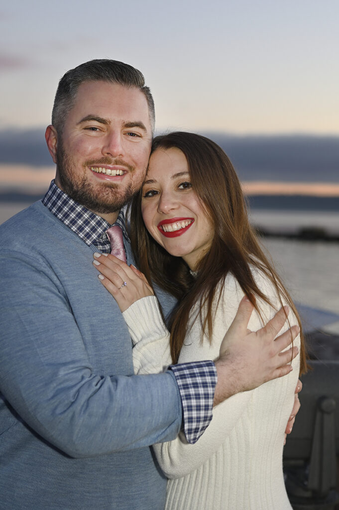 couple smiling at dawn during their sunrise engagement session in Nyack
