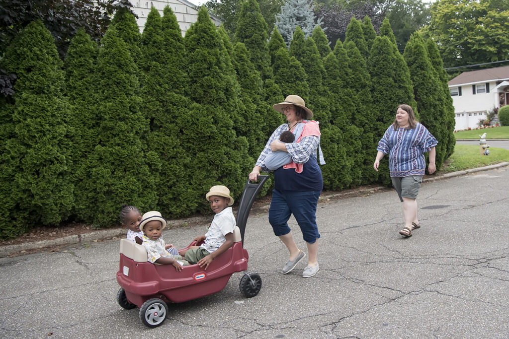 family on a walk during their Day in the Life family session in Scarsdale, New York