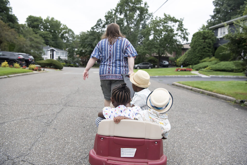 family on a walk during their Day in the Life family session in Scarsdale, New York