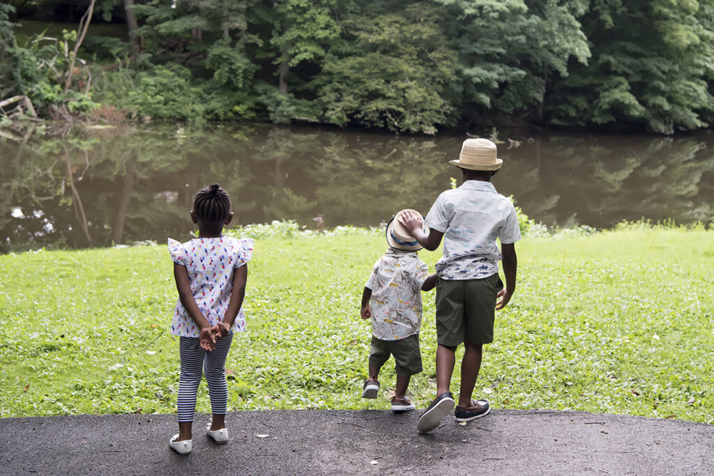 family running in the park during their Day in the Life family session in Scarsdale, New York