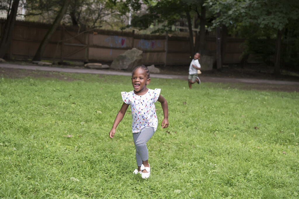 family playing in the park during their Day in the Life family session in Scarsdale, New York